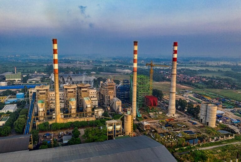 Aerial view of an industrial plant with smokestacks in Serang, Banten, Indonesia during daylight. rendah emisi. low emission.